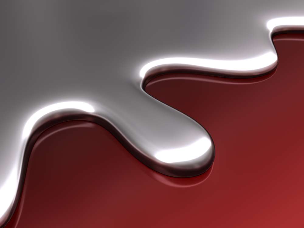 liquid mercury on red background